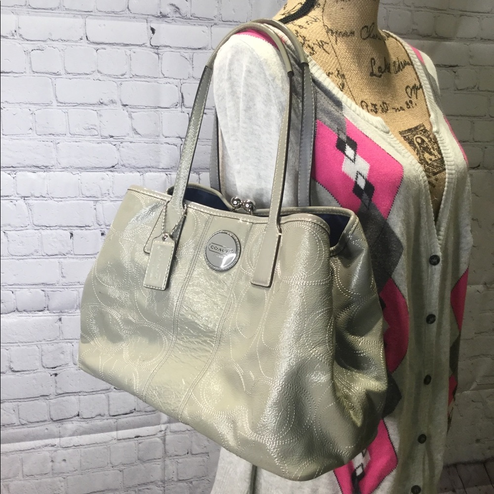 Coach kiss lock closure signature bag